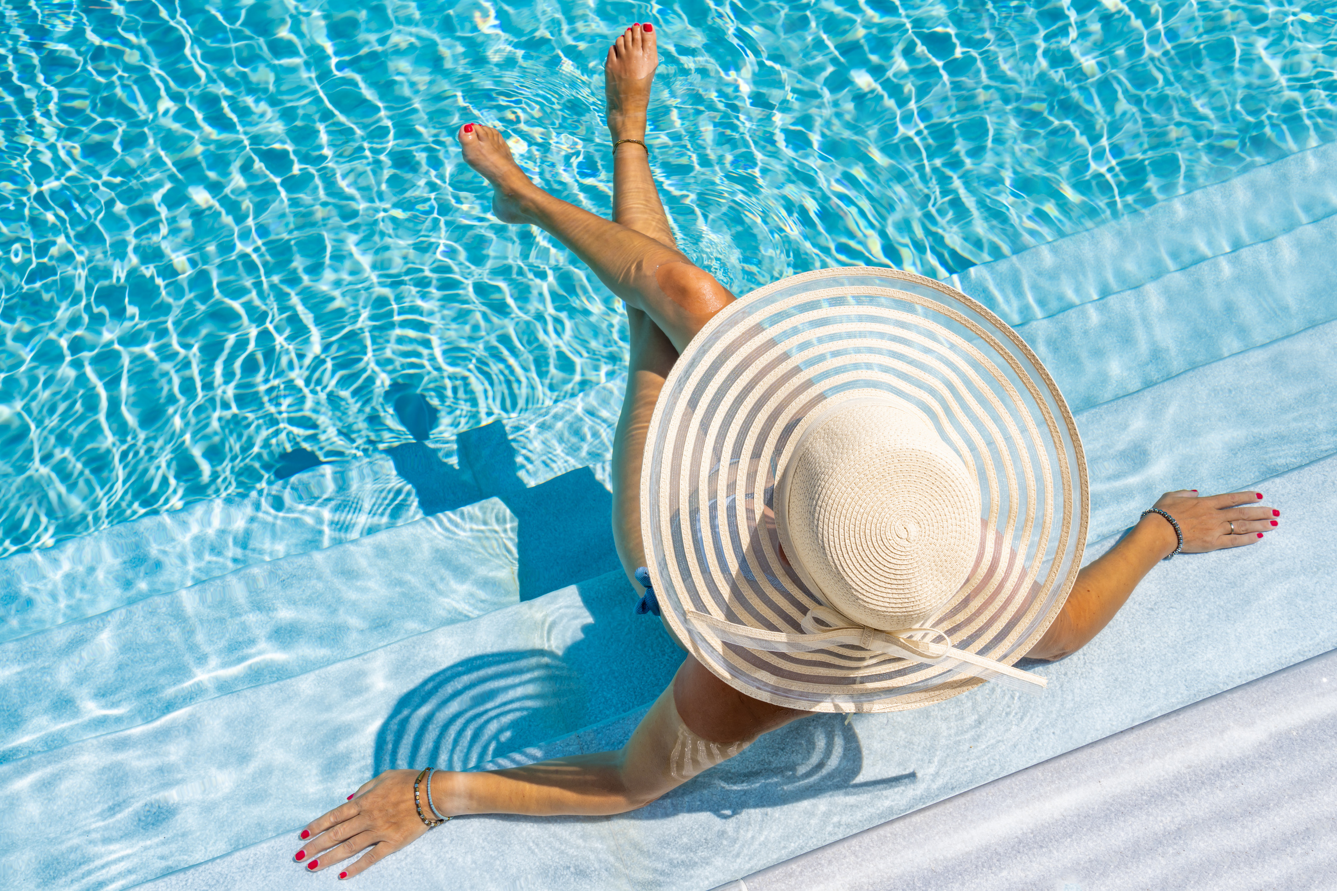 Woman in Luxury Spa Resort Pool